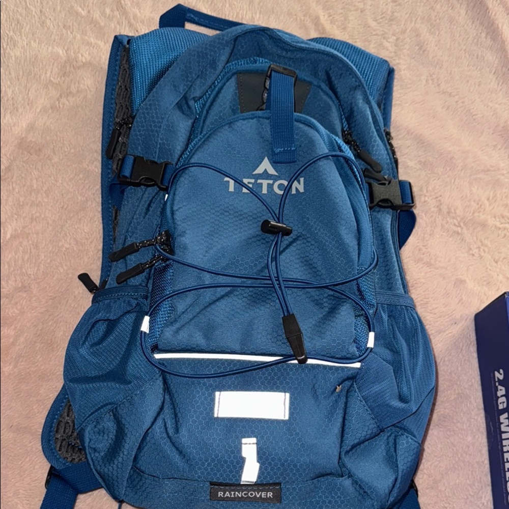 Blue Backpack with Padded Straps and Reflective Accents